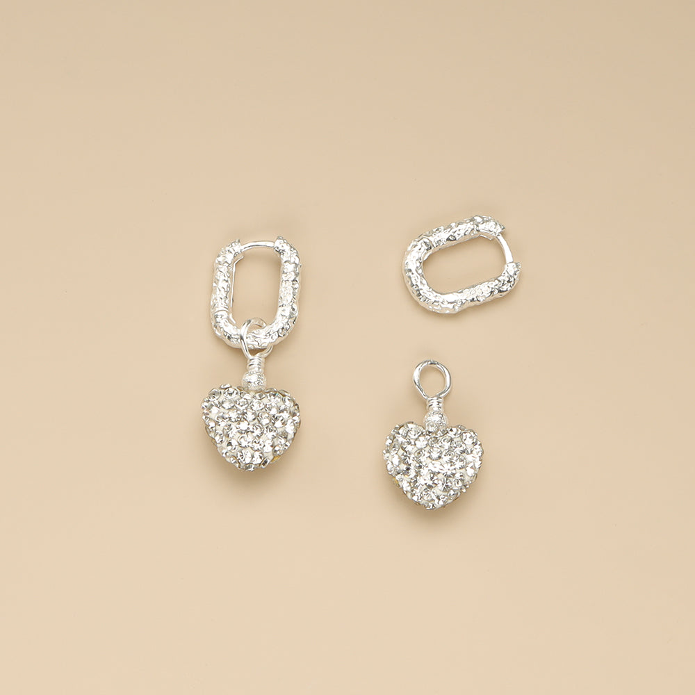 The heart is separate from the 925 silver earrings.