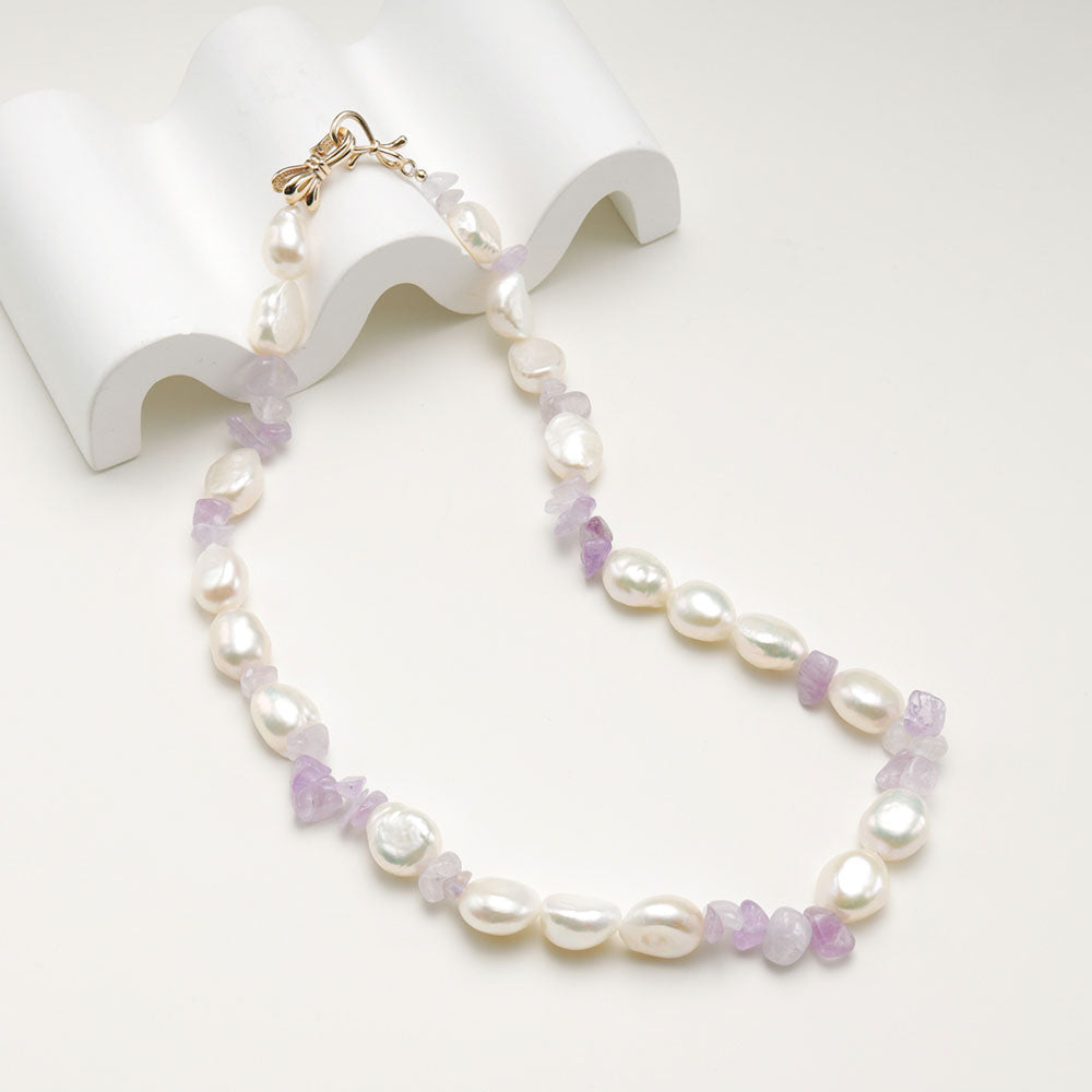 An amethyst baroque pearl necklace.