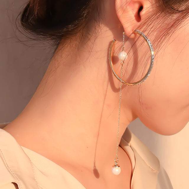 Women wear long dangle earrings,