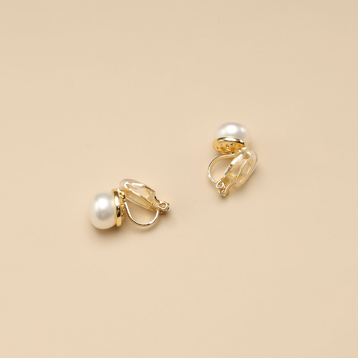 The side shot of clip on pearl studs.