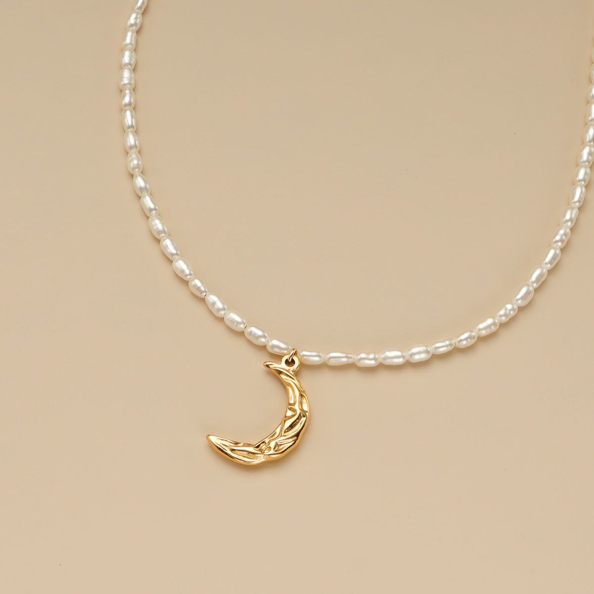 Crescent moon necklace's close shot.