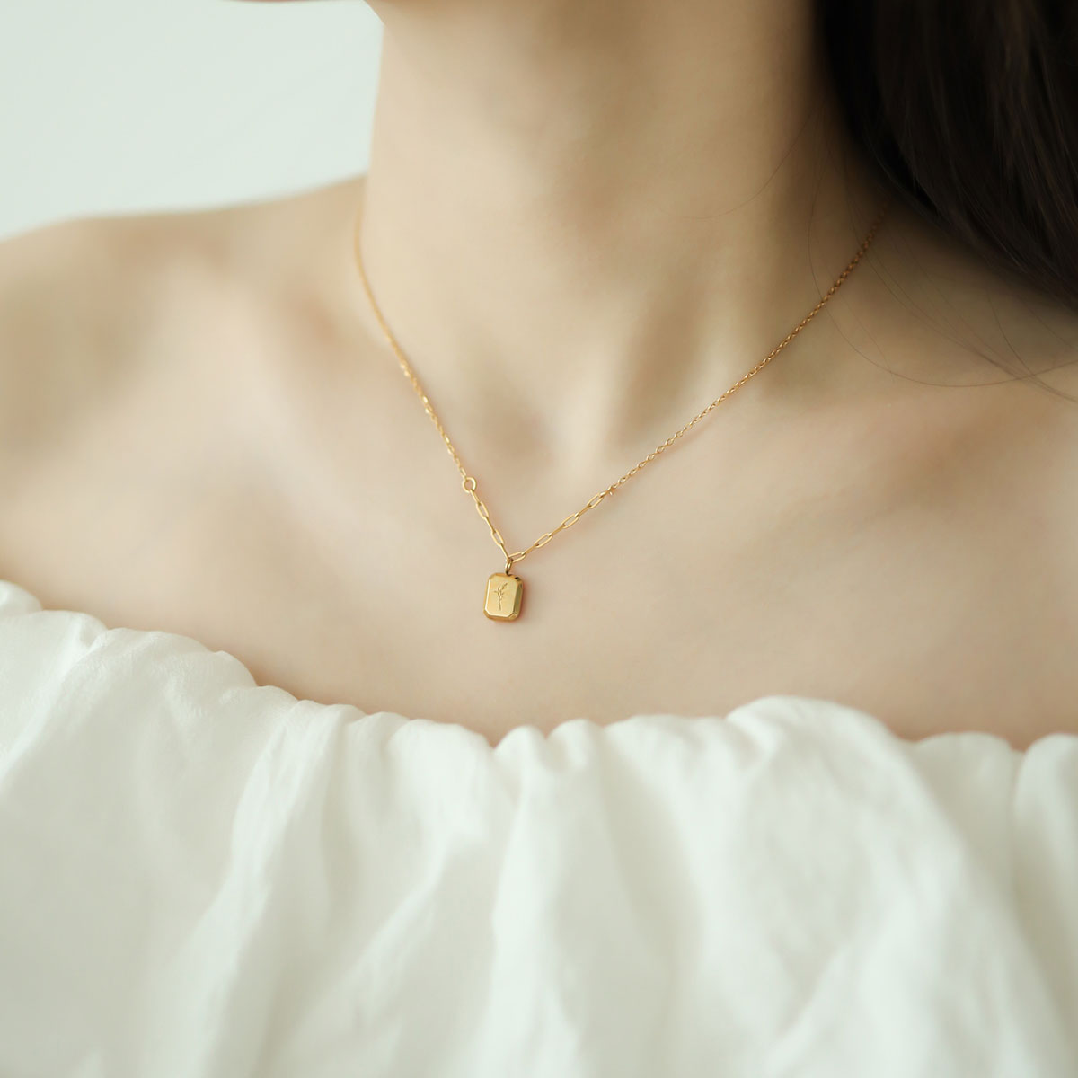 Women wear dainty gold necklace.