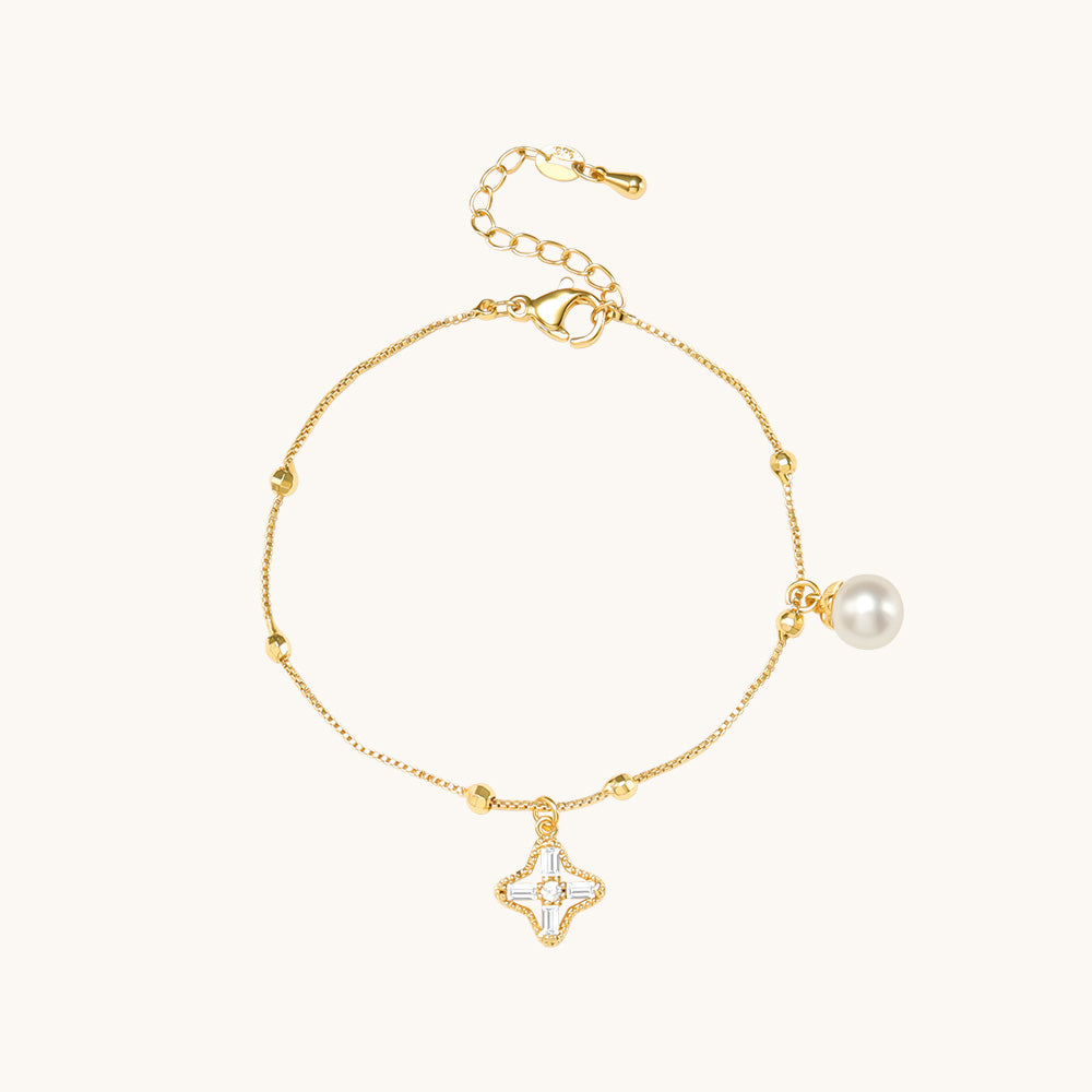 A delicate gold bracelet with pearl.