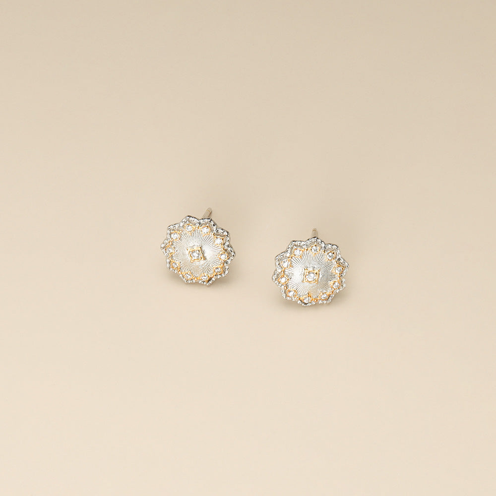 A pair of designer earrings.