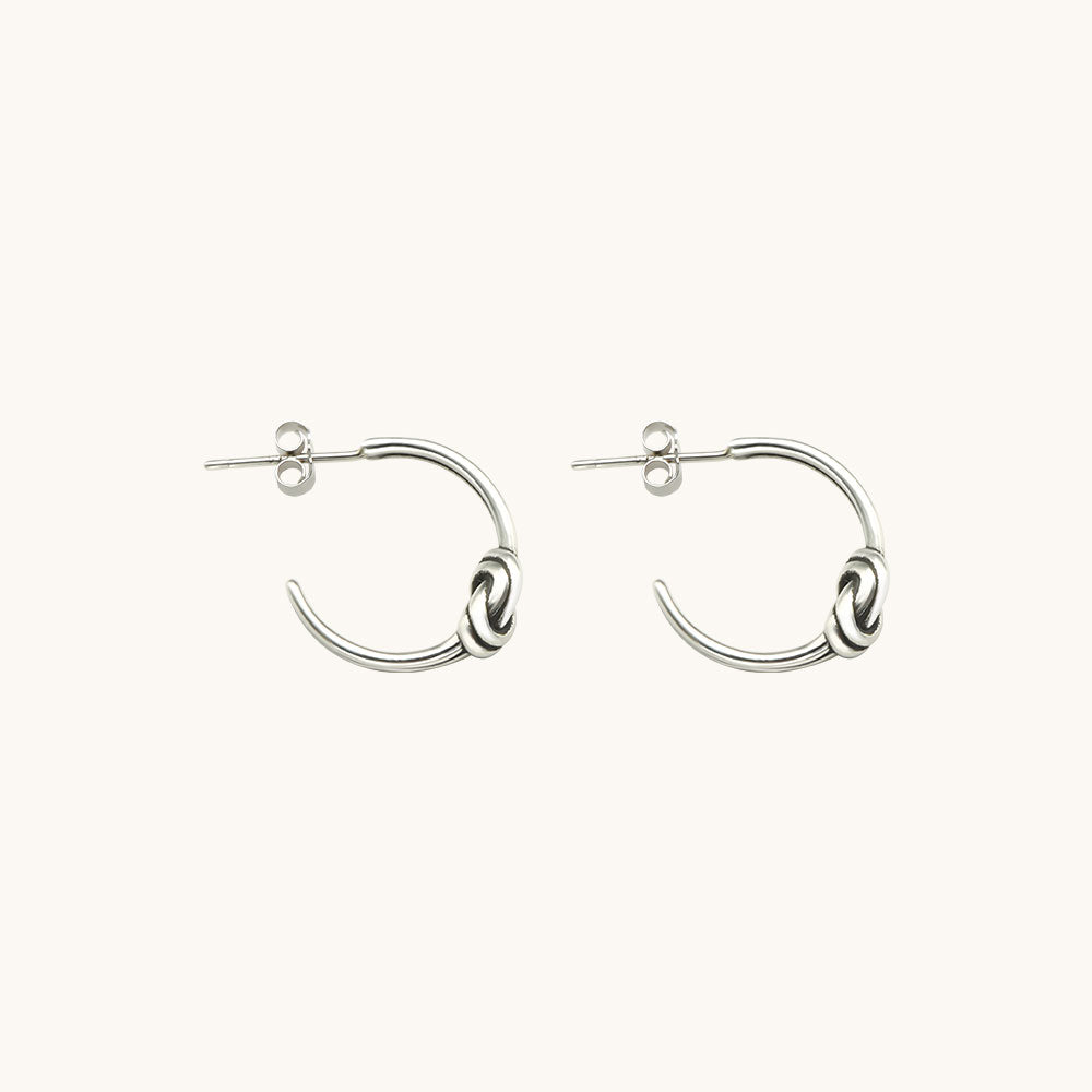 A pair of designer earrings.