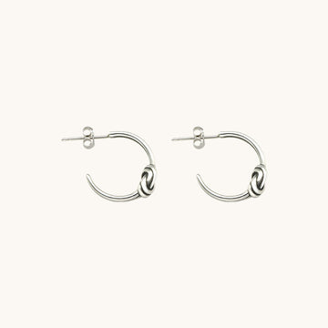 A pair of designer earrings.