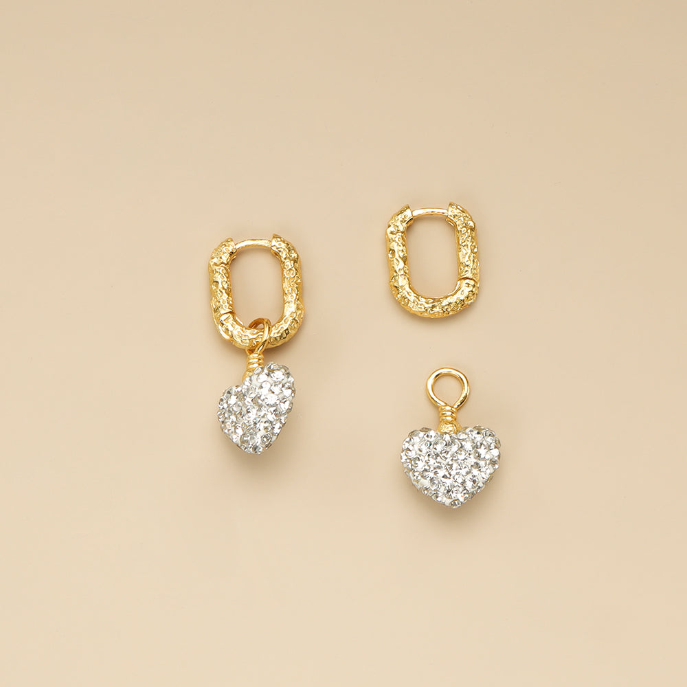 The heart is separate from the diamond heart earrings.