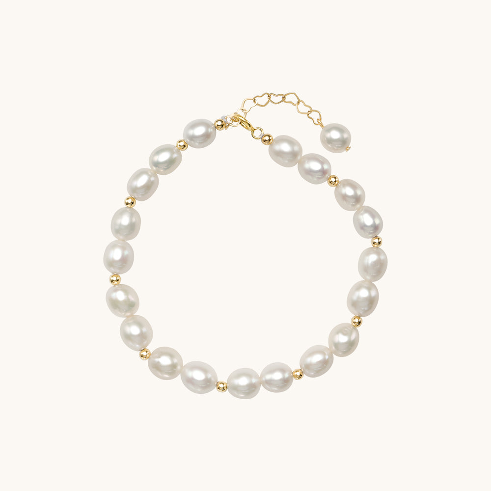 A gold and pearl bracelet.