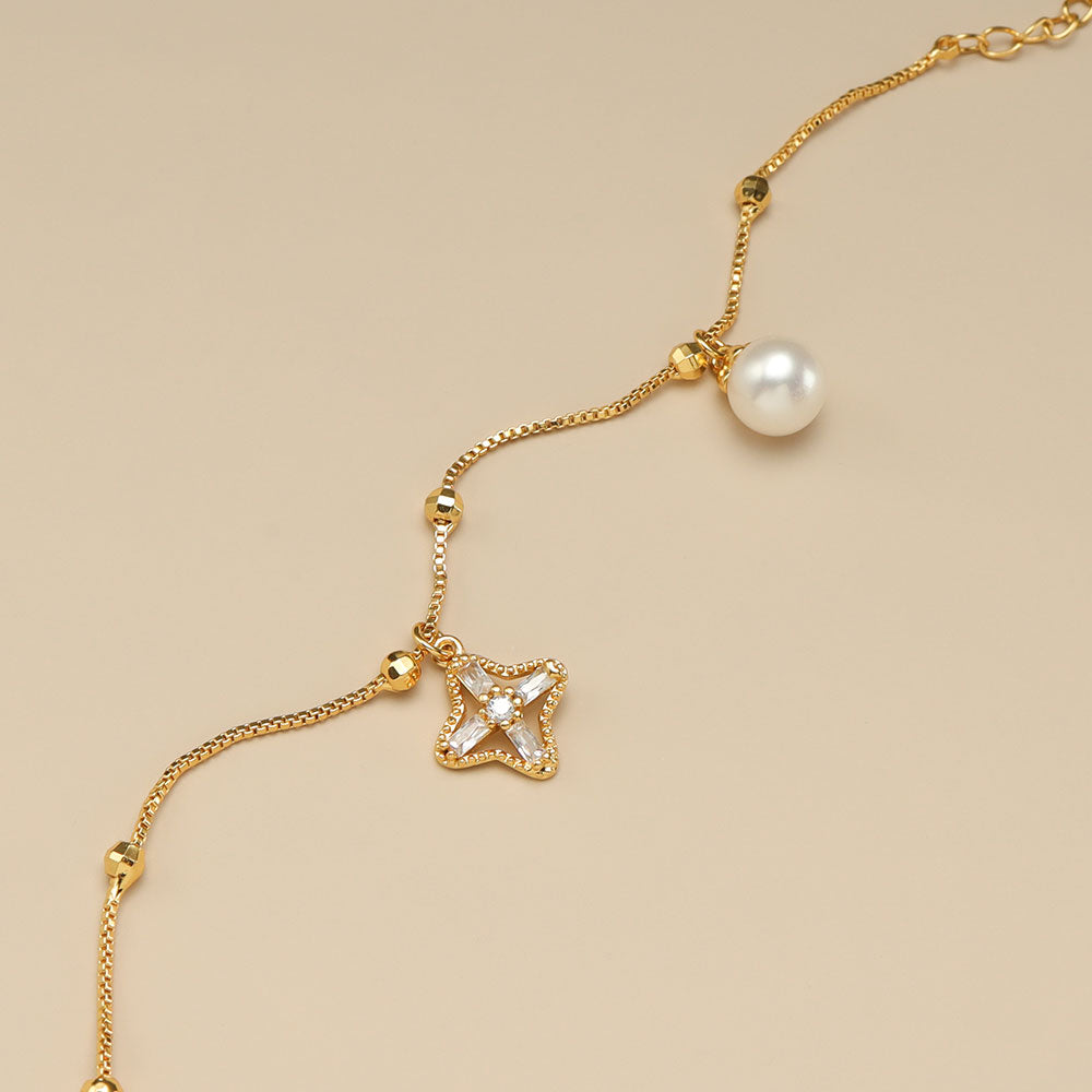 Gold charm bracelet for women.
