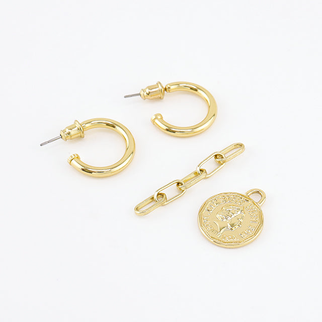 The separate gold coin earrings.