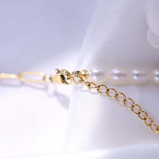 The gold necklace clasp.