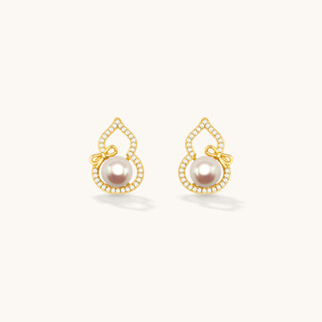 A pair of gold pearl earrings,