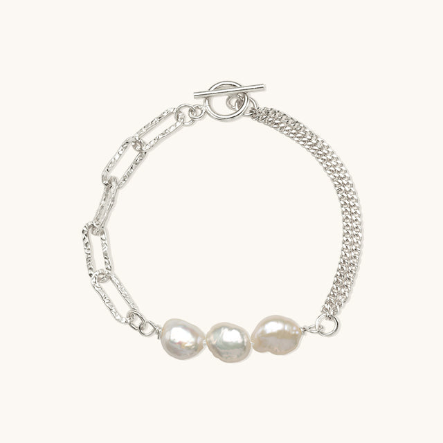 Gold pearl hand chain bracelet in silver.