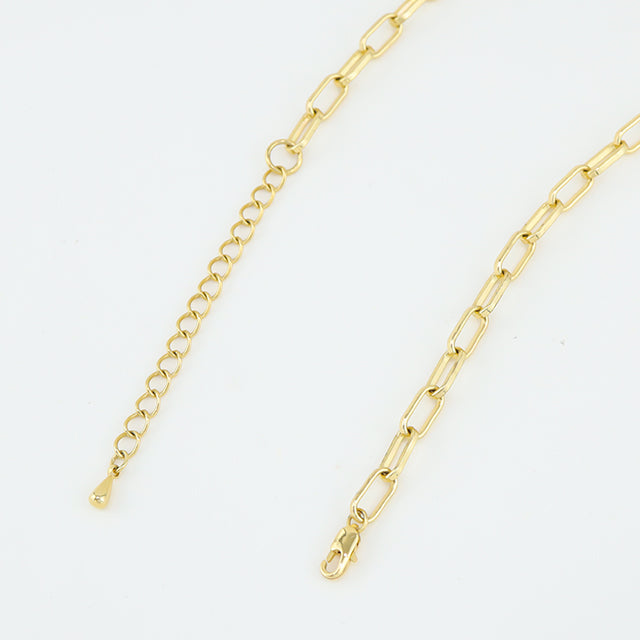 A gold plated neckalce clasp.