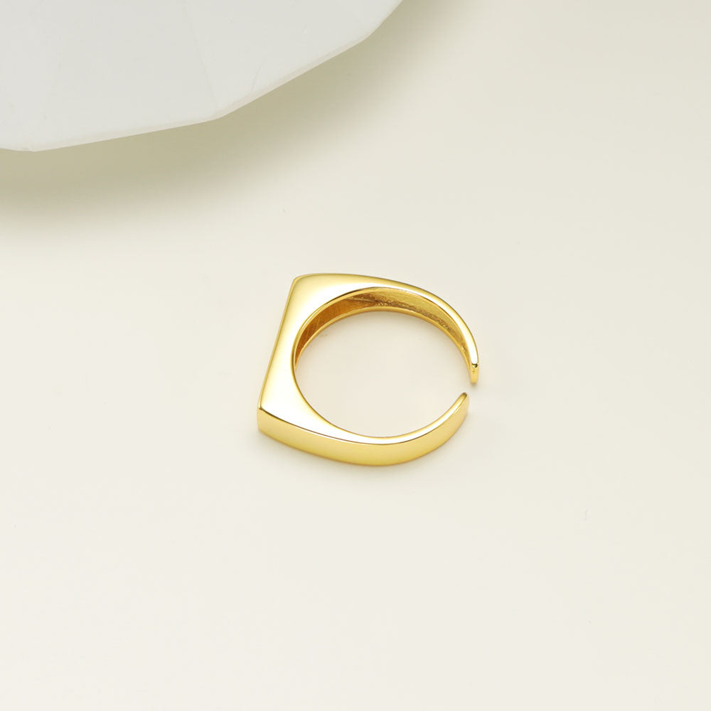 Gold signet ring.