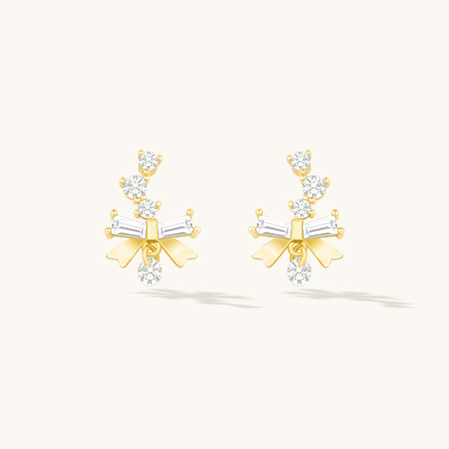 A pair of gold small earrings design.