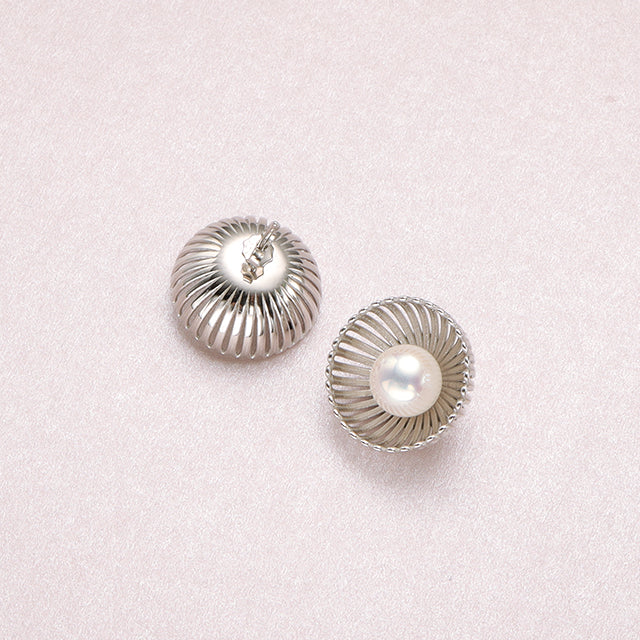 The back of handmade silver pearl earrings.