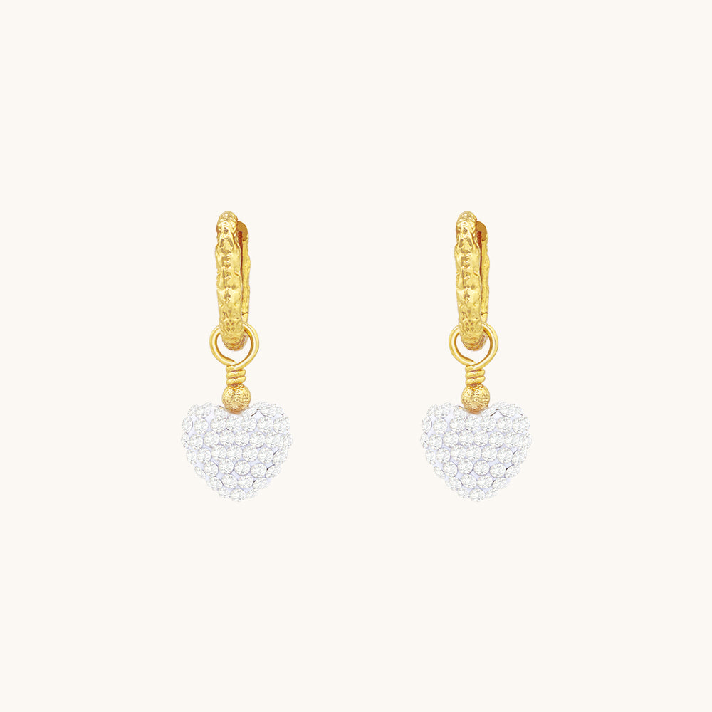 A pair of heart drop earrings.