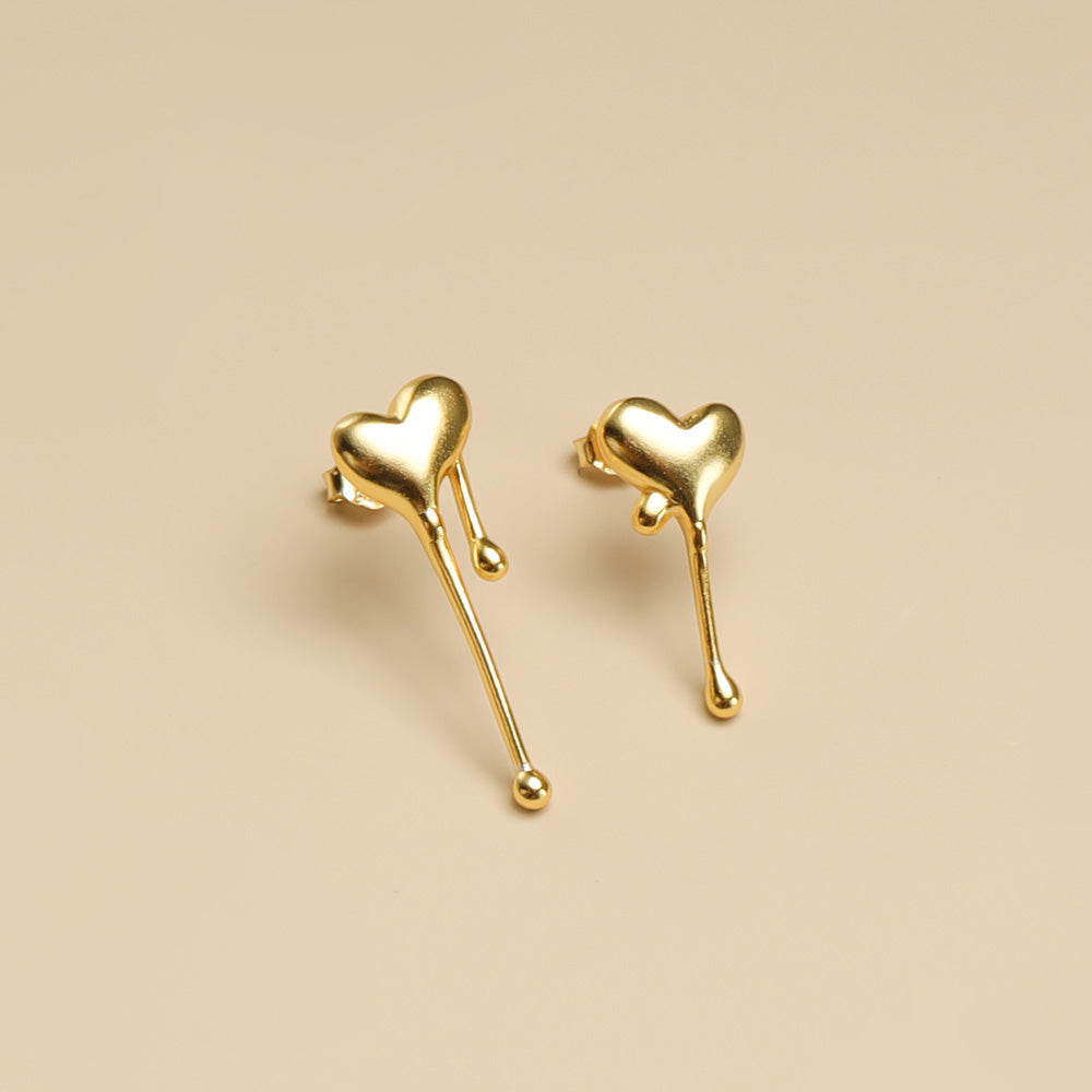 A pair of heart shaped earrings.