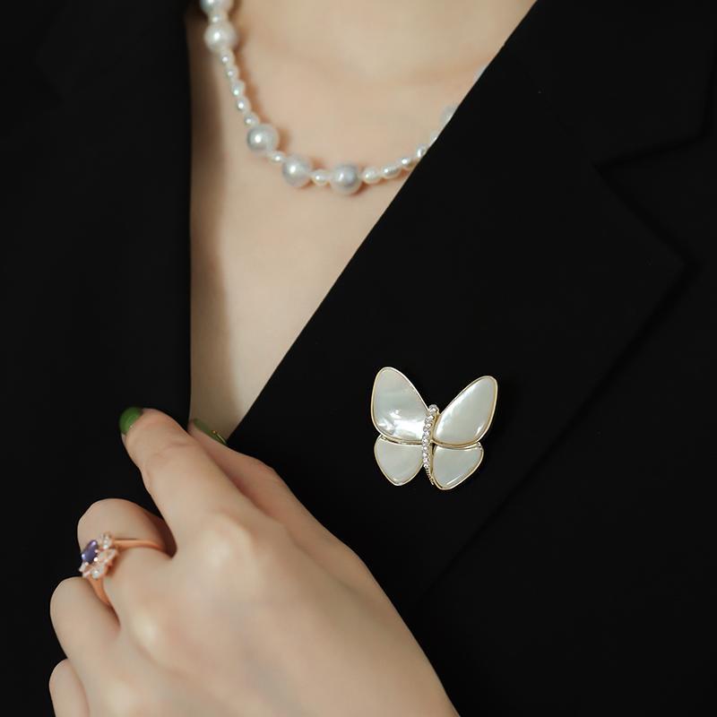 Ladies brooch design with butterfly.