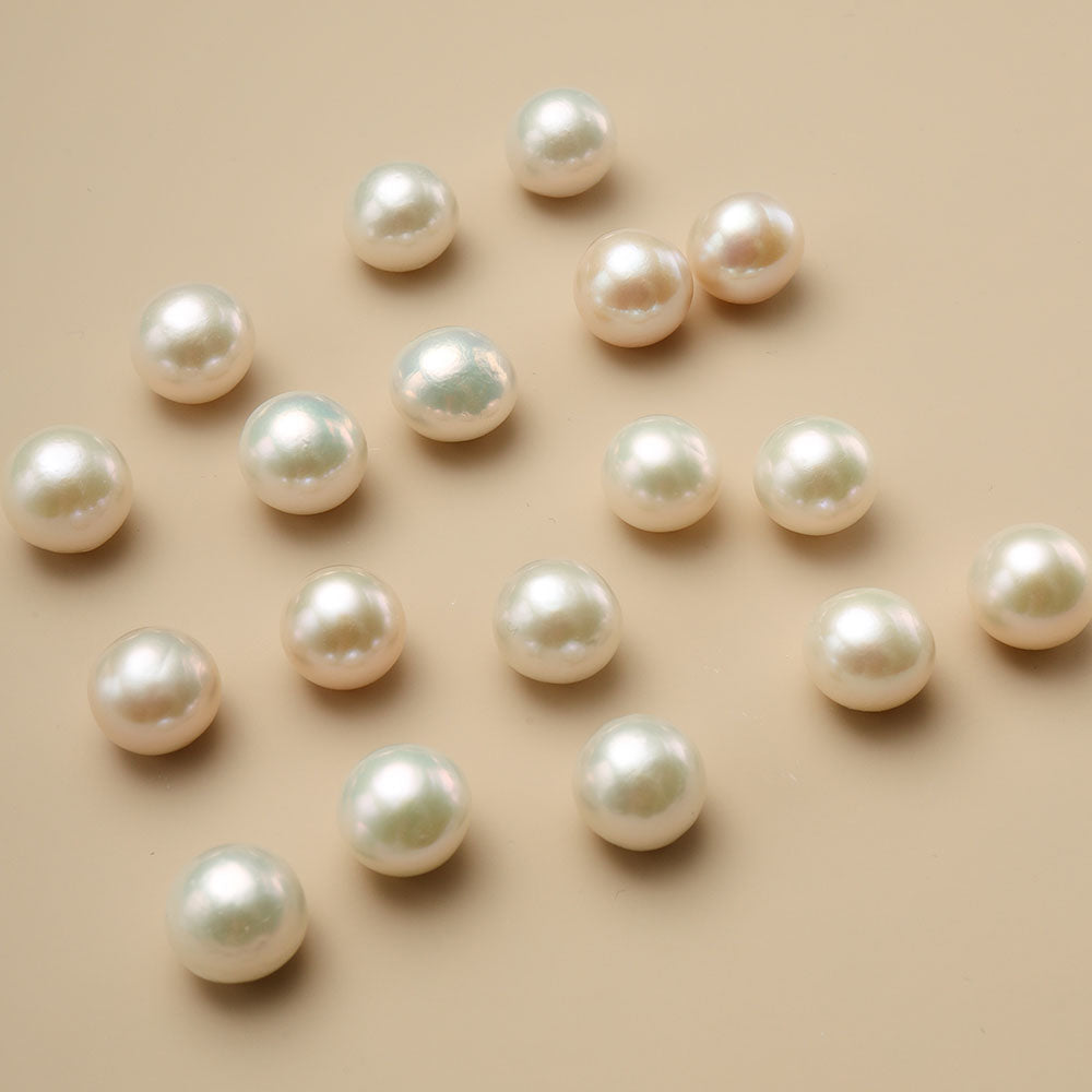Eighteen large fresh water pearls on brown cloth.