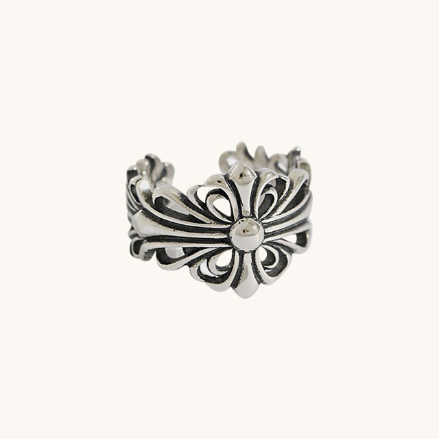 A silver floral cross male ring.