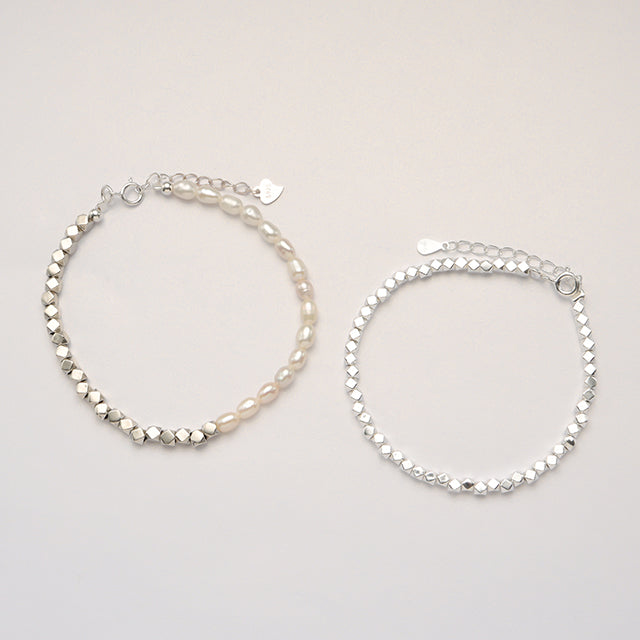 Two mens chain bracelets.