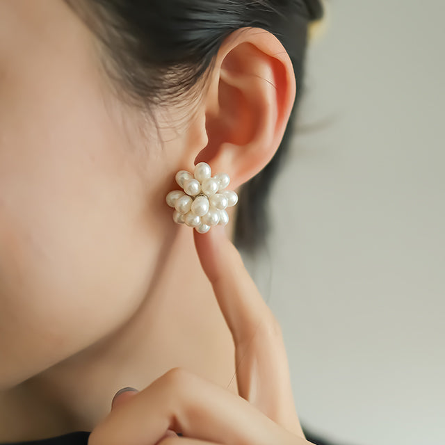 Modern bridal earrings on women ear.