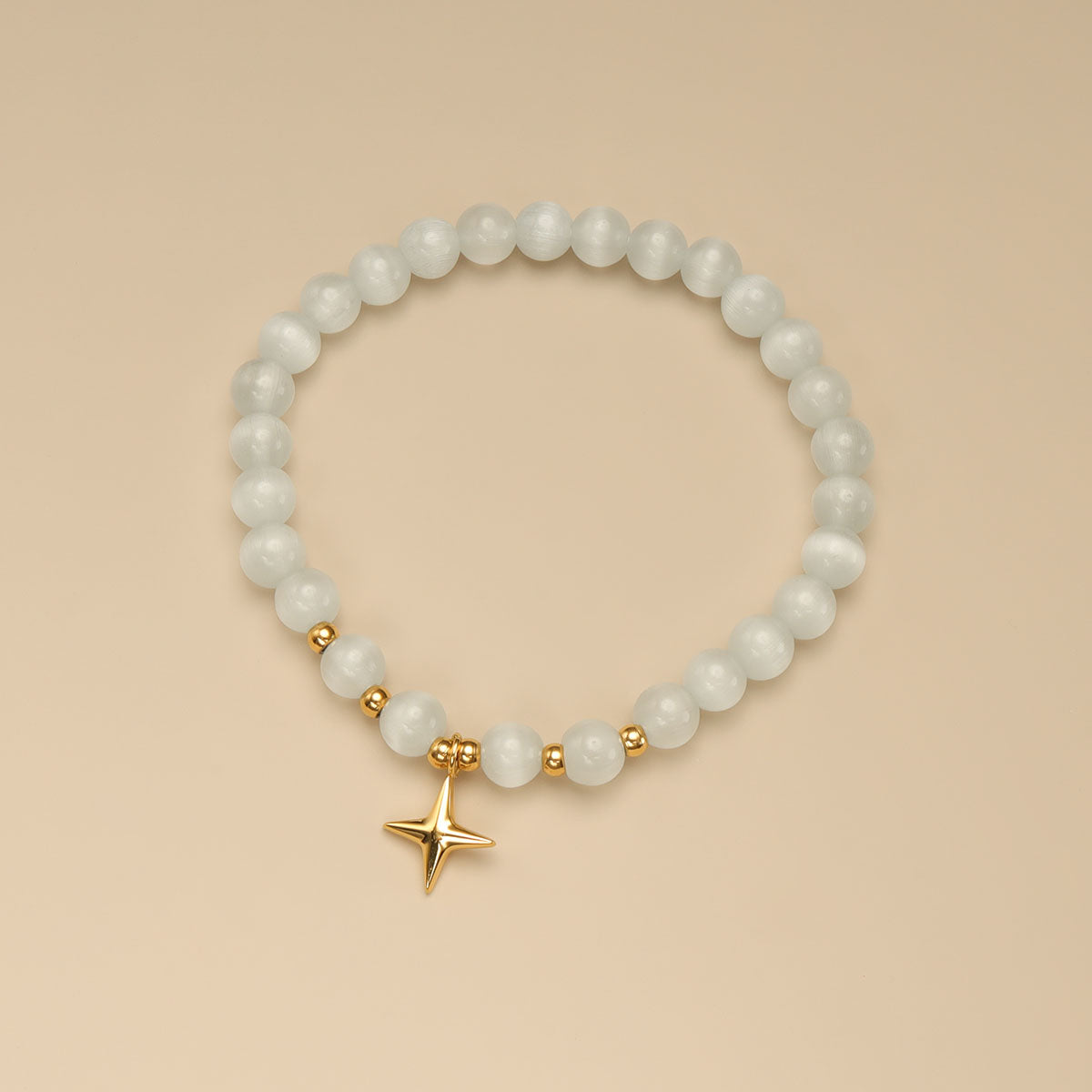 A moonstone bracelet with star on it.