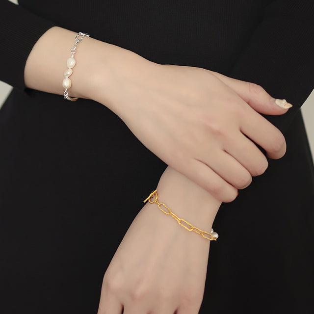 New arrival gold and silver bracelet on women wrist.