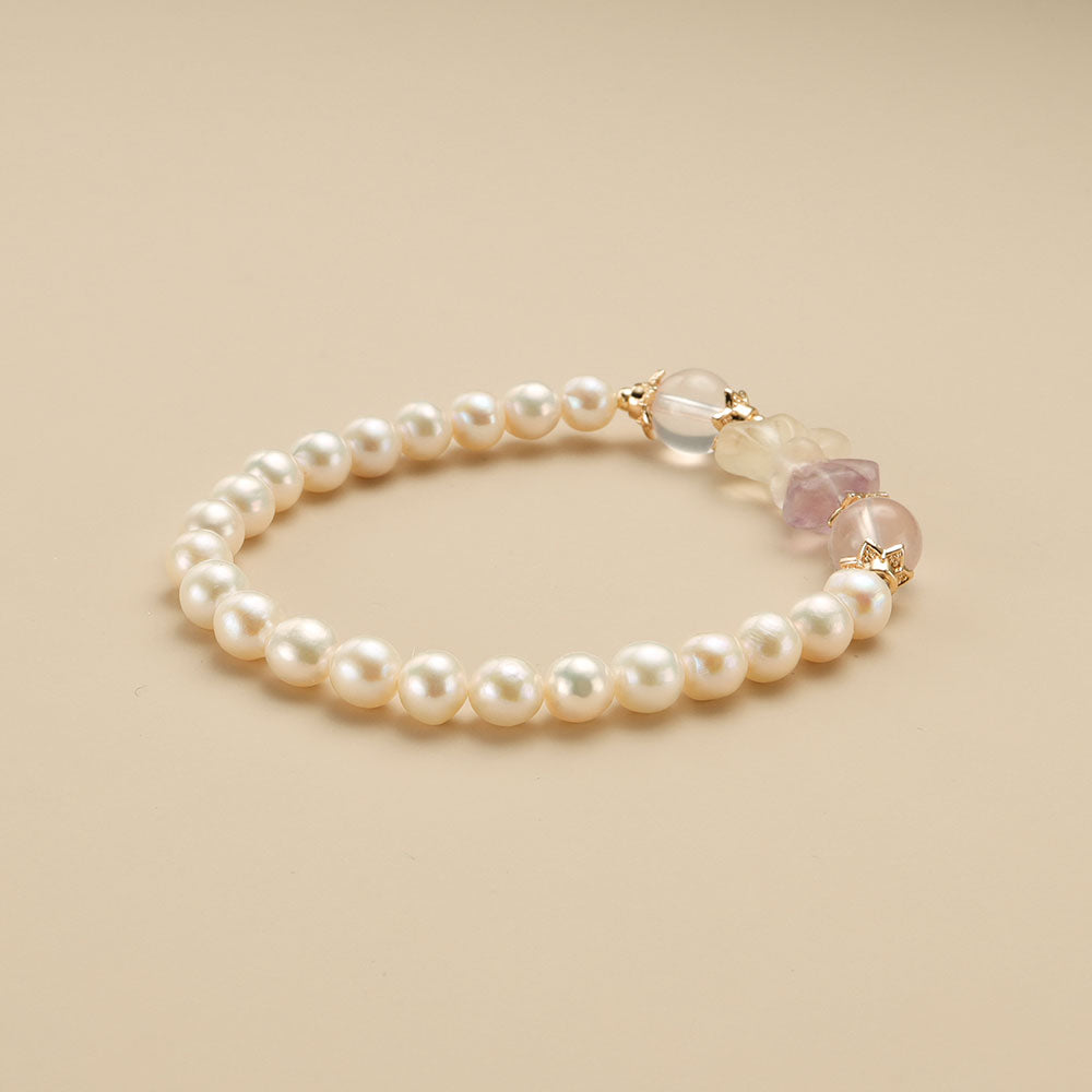 A pearl bow bracelet.