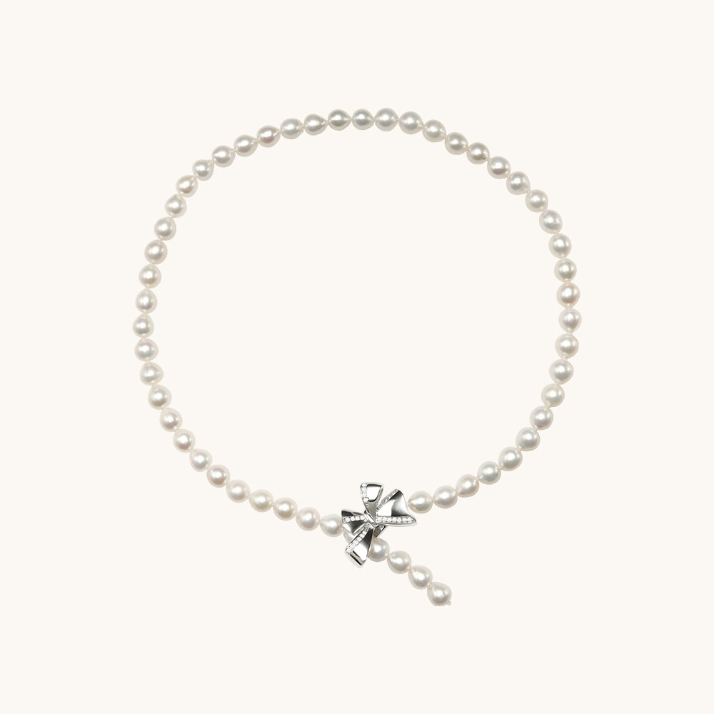 A pearl necklace with butterfly.