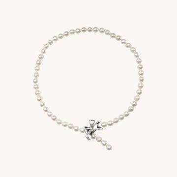 A pearl necklace with butterfly.