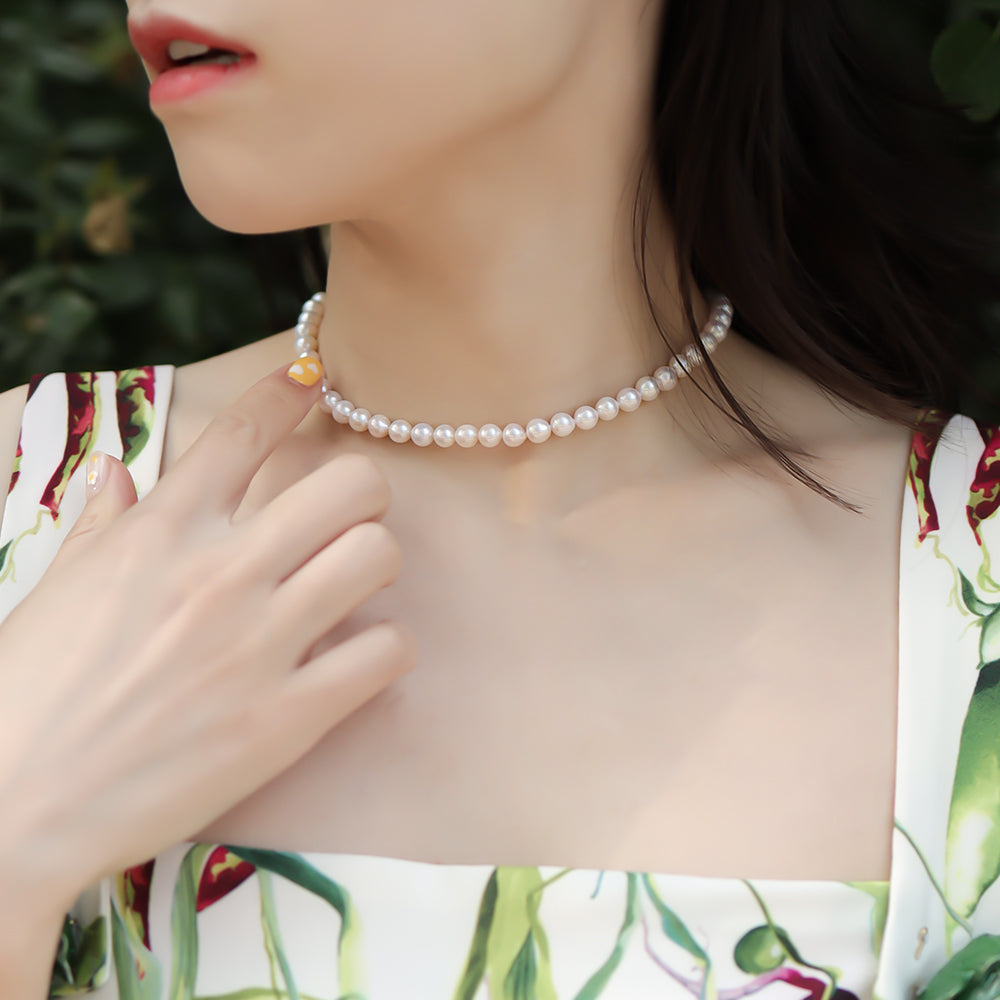 Women wear a pearl necklace.