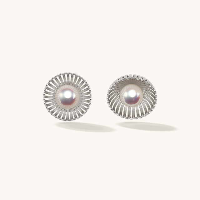 A pair of pearl sterling silver studs earrings.