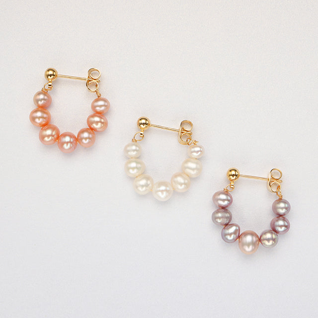 Three pink white purple pearl ladies earrings.