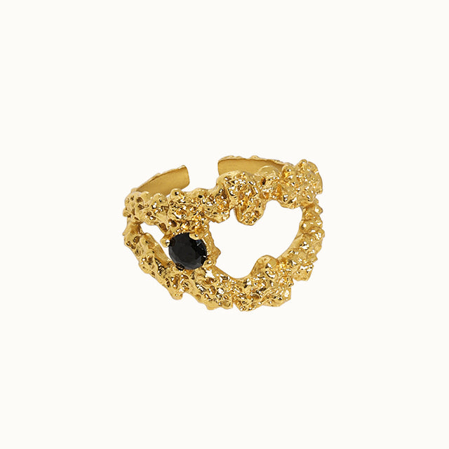 A pretty black stone ring in gold.