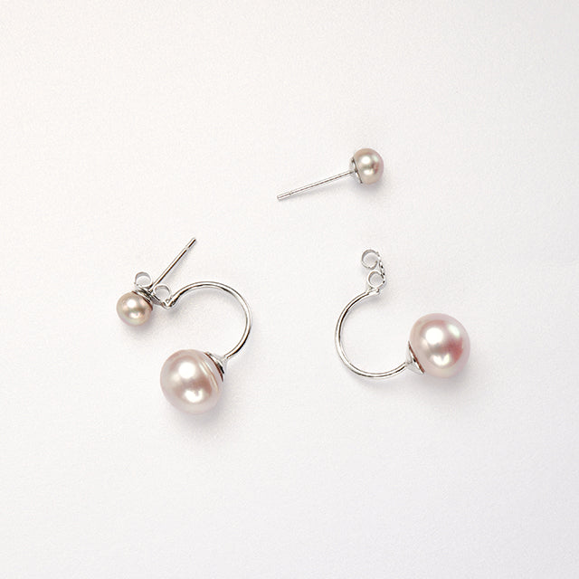 A pair of purple freshwater pearl earrings.