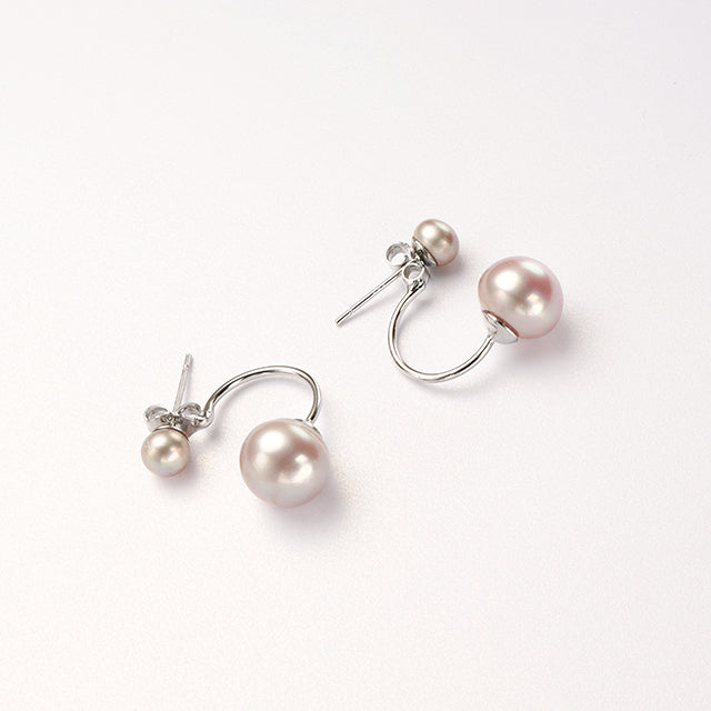 A pair of purple pearl studs.