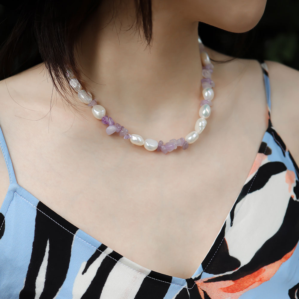Women wear real amethyst necklace.