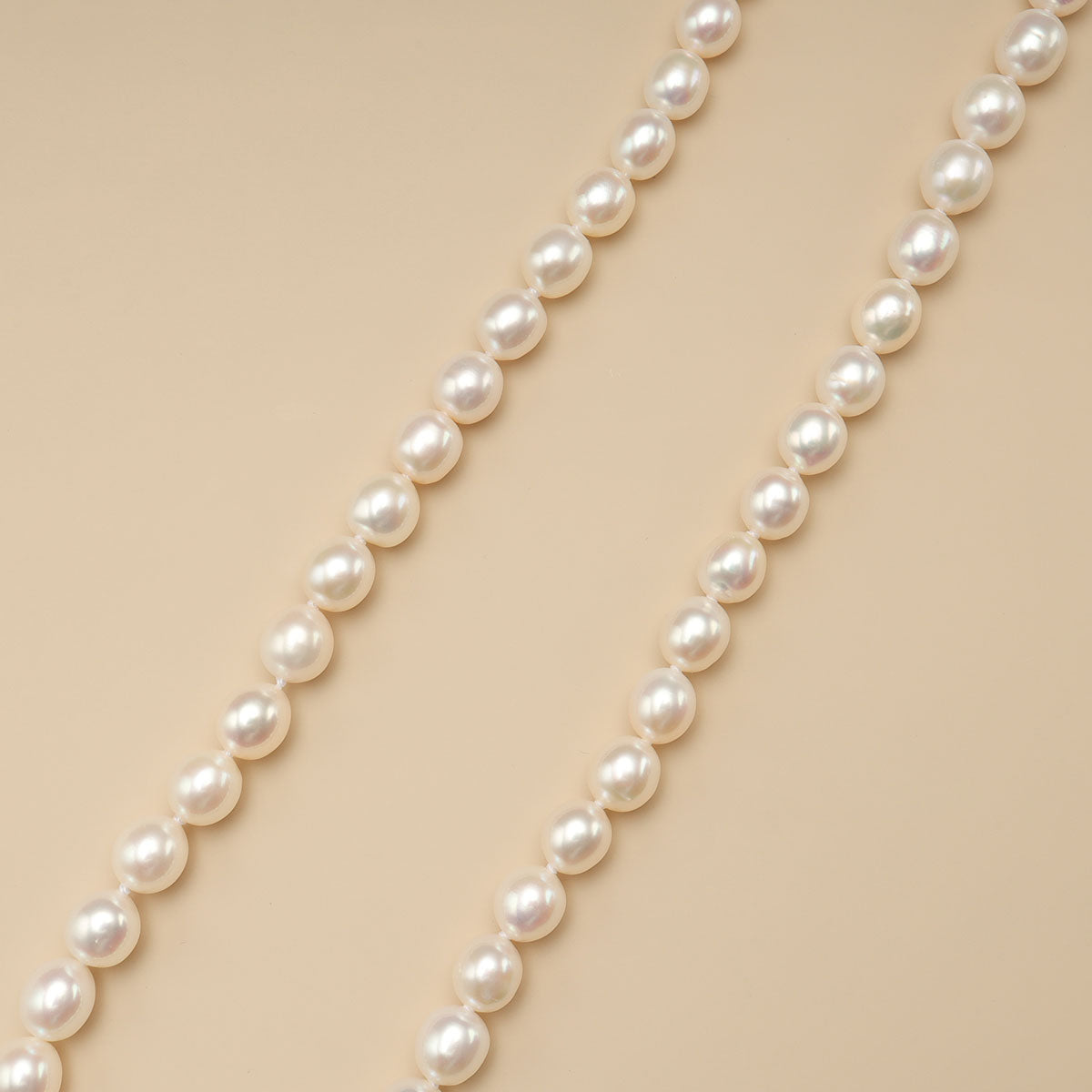 The close shot of rice pearl necklace.