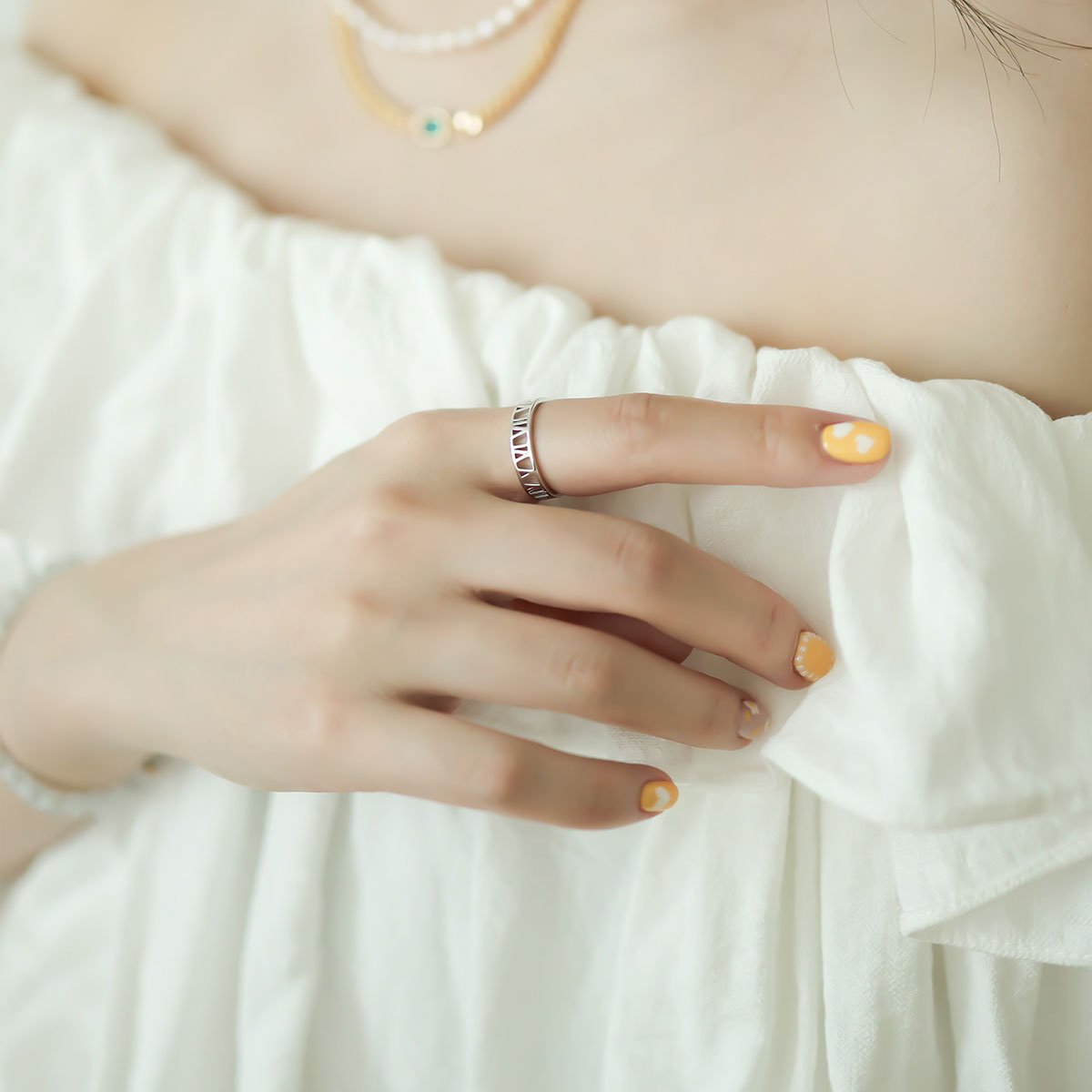 Women wear a ring with roman numbers.