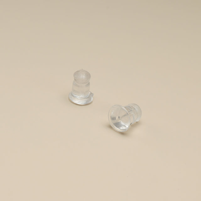 A pair of rubber earrings backs.