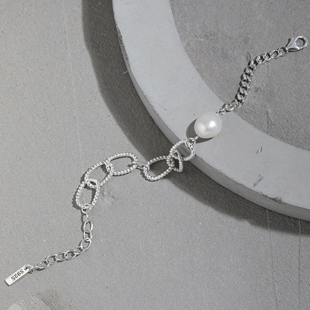 A new design silver bangles on cement stone.s