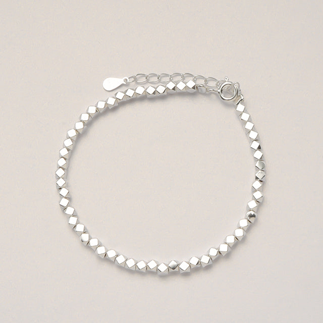 A silver beads adjustable bracelet.