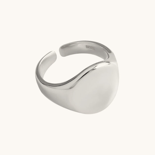 A silver signet chunky ring.