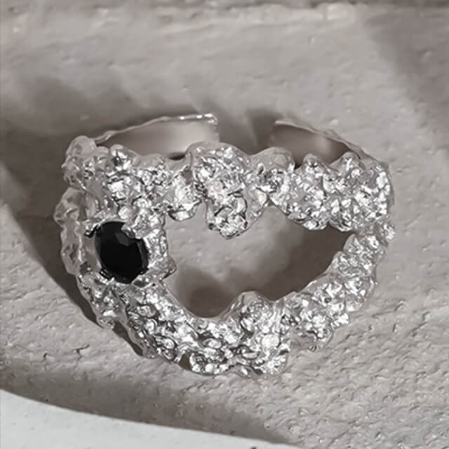 A silver fashion ring.