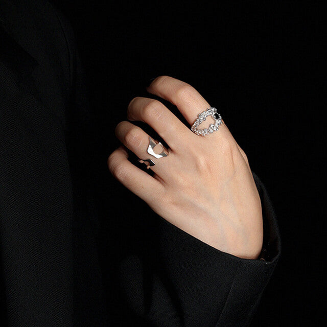 A women in black wear silver ladies ring.