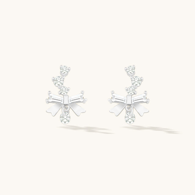 A pair of silver small earrings design.