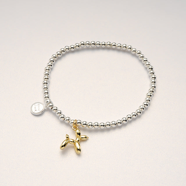 A beaded simple bracelet with charms.